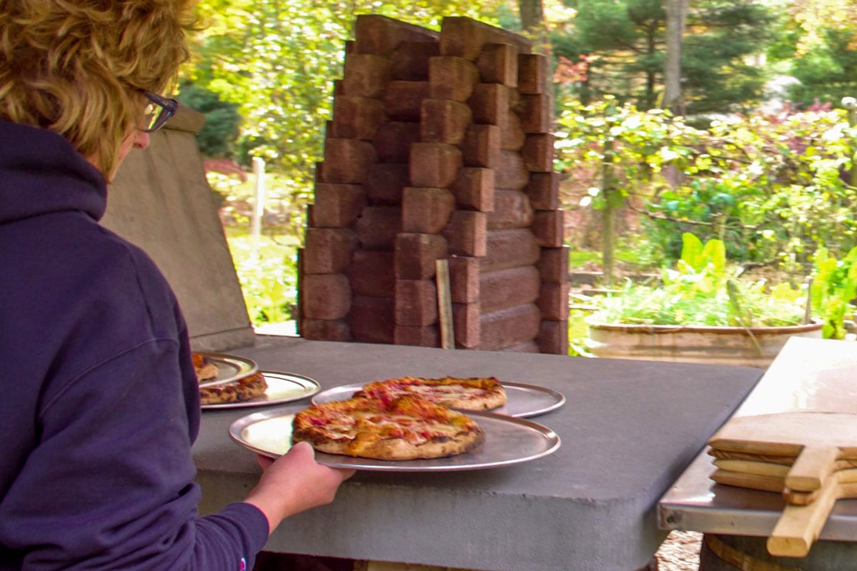 Angela-atBrickOven-w-Pizza